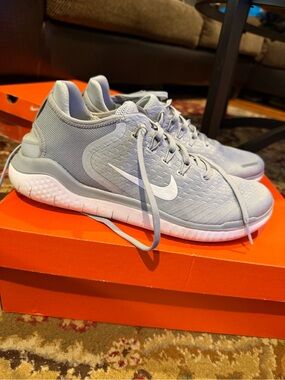 Nike Light Gray Athletic Training Shoes with White Swoosh